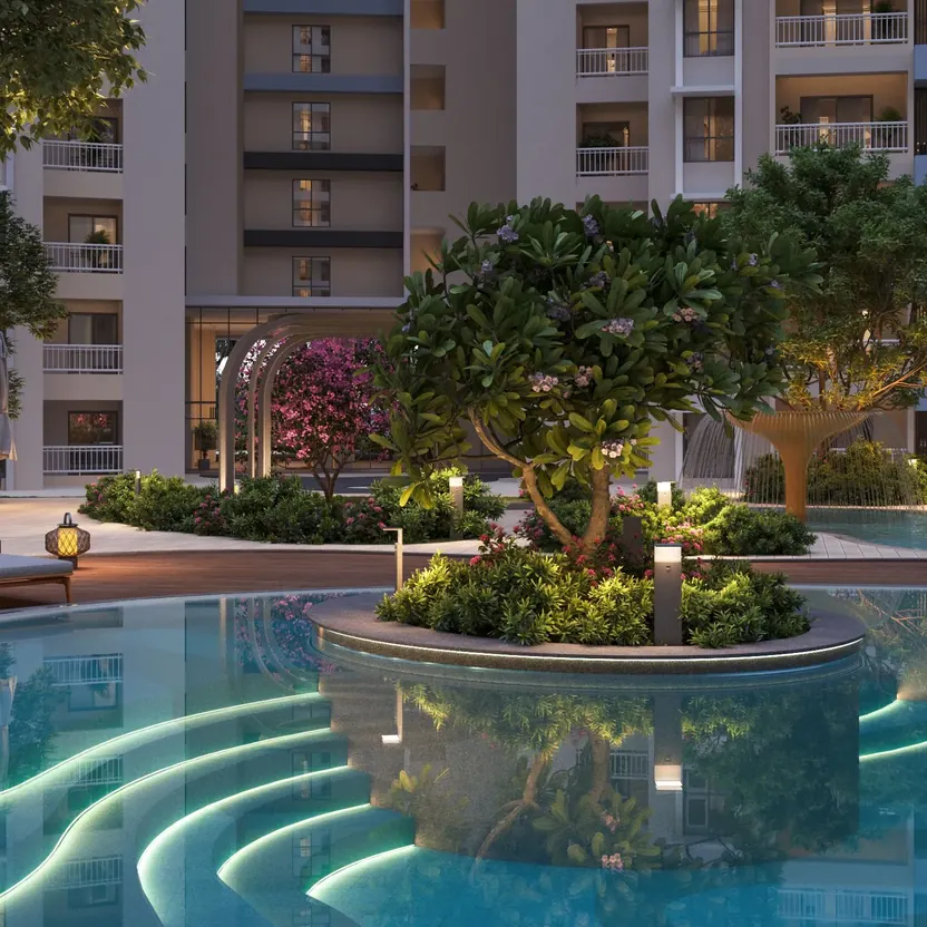 A lit pool with stepped edges around a planted tree island