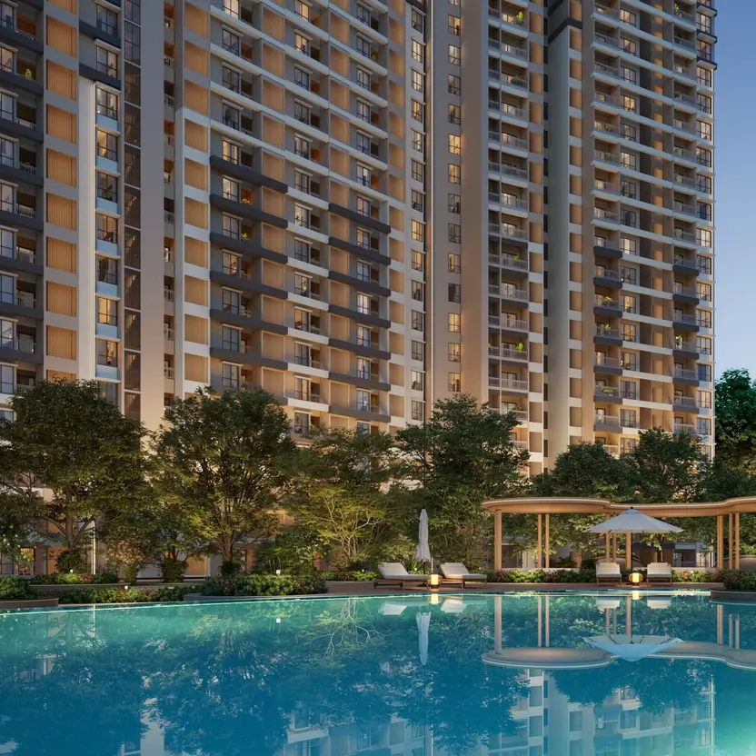The swimming pool and cabanas below the towers at evening