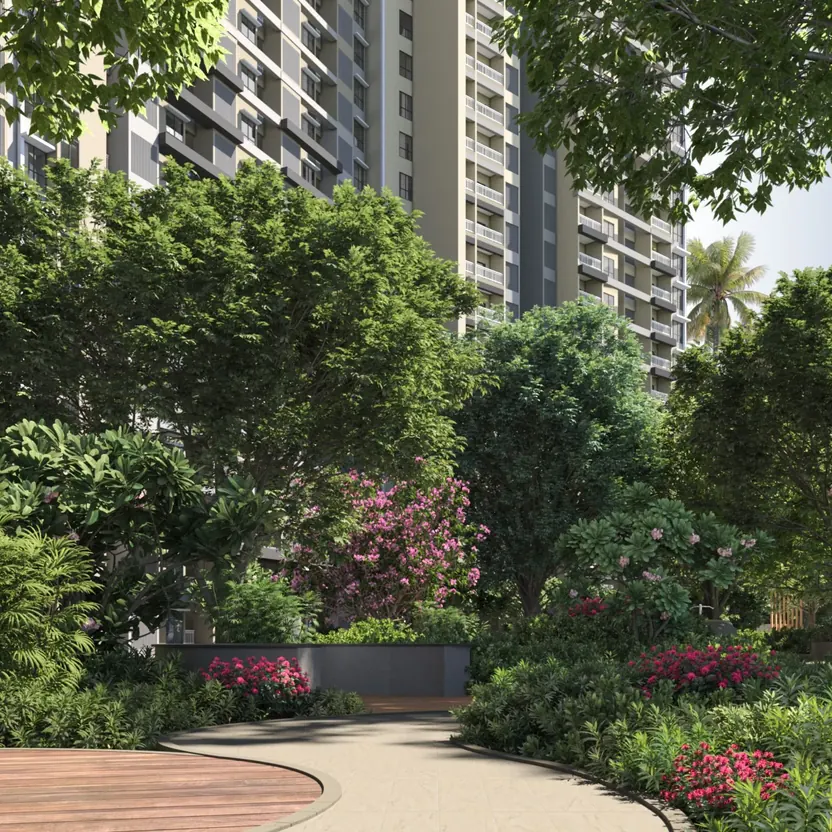 A garden walk through flowering trees below the towers